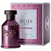 A bottle of Bois 1920 perfume in front of a box.