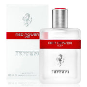 A sleek transparent bottle featuring red accents and the iconic Ferrari logo is elegantly placed next to its matching box. Experience the aromatic spicy fragrance of Ferrari Red Power Ice3 125ml Eau De Toilette, brought to you by Ferrari in this stylish design.