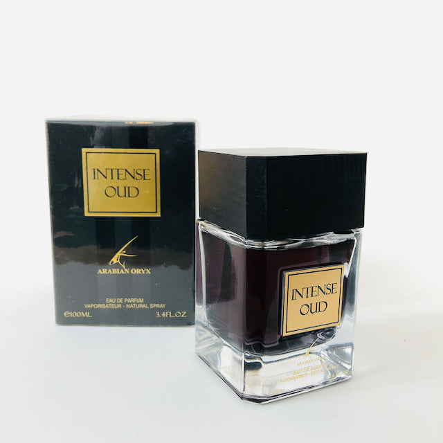 A bottle of Paris Corner Intense Oud (Arabian Orynx) 100ml Eau De Parfum on a white table.