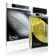 A bottle of Lattafa Najdia 100ml Eau De Parfum with a leaf on it.