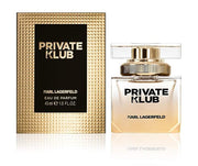 The sophisticated bottle of Karl Lagerfeld Private Klub Femme 45ml Eau De Parfum is placed next to its box, which features elegant gold accents. This floral-oriental fragrance embodies a luxurious essence that suits any occasion.