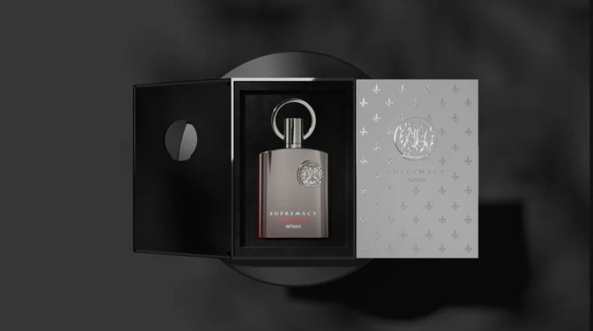 A bottle of Afnan Supremacy Not Only Intense 100ml Extrait de Parfum by Rio Perfumes in a box on a black background.